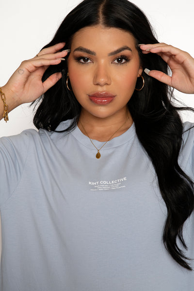 KIHT T-shirt in Sky Blue worn by a model in a white out studio close up shot