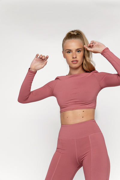 UK ethical activewear Long sleeve gym crop top in smoothie pink colour with punched panel back detailing